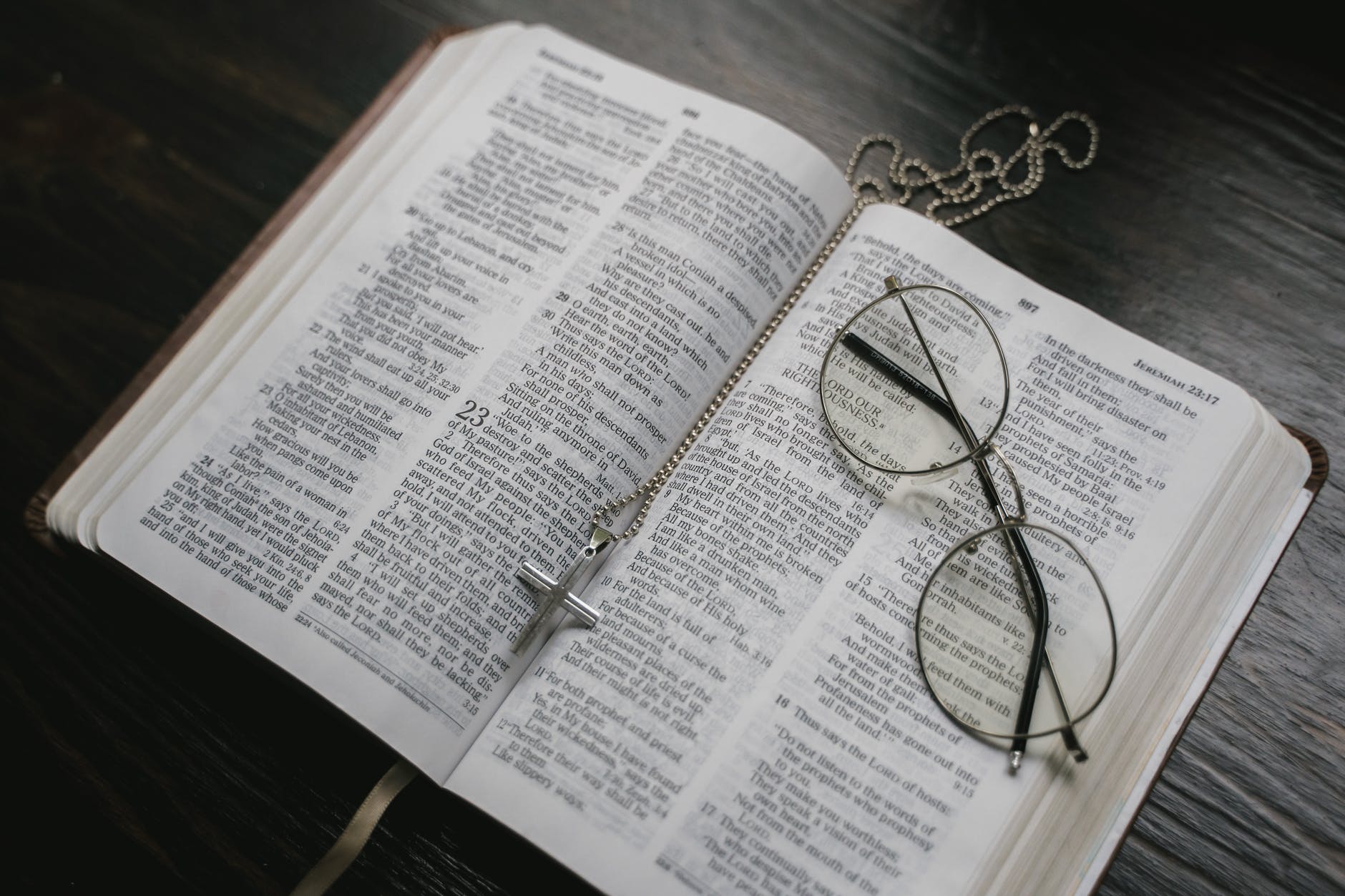 black framed eyeglasses on white book page